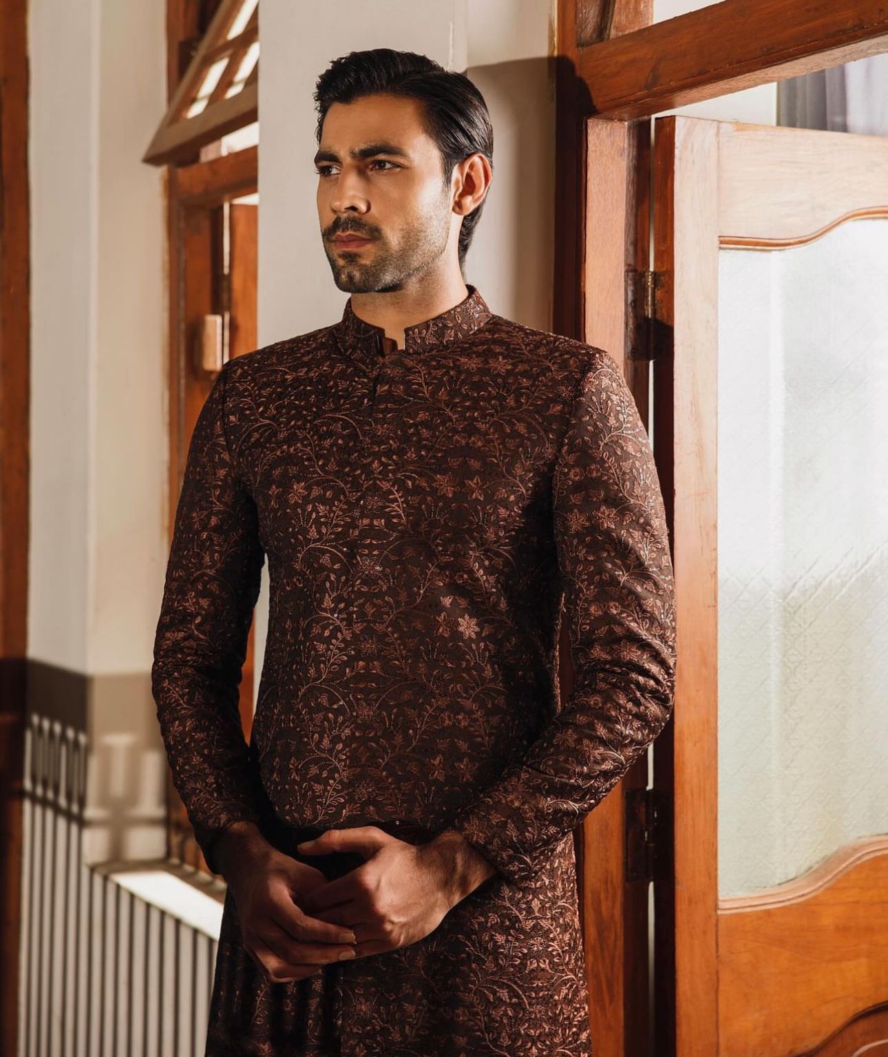 Emraan Rajput's Dark Brown Embroidered Sherwani - A masterpiece from the Nigah-e-Ishq collection, blending tradition with modern elegance. Elevate your style on your special day with the detailed floral embroidery and exquisite dark brown hue. Explore the pinnacle of elegance and make a lasting impression